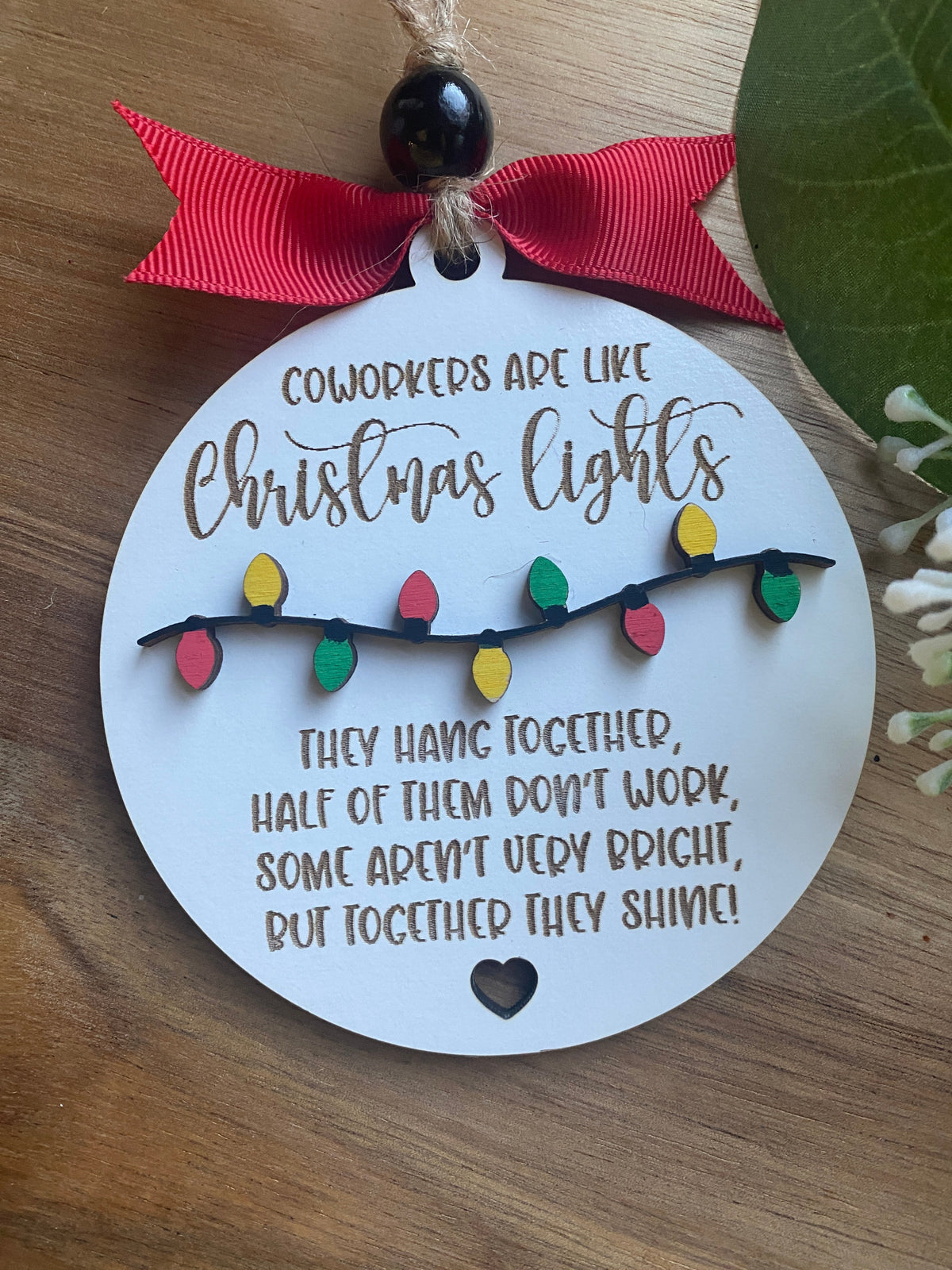 Graceful Creations by Graciela round white wooden ornament with Christmas light design and funny coworker quote