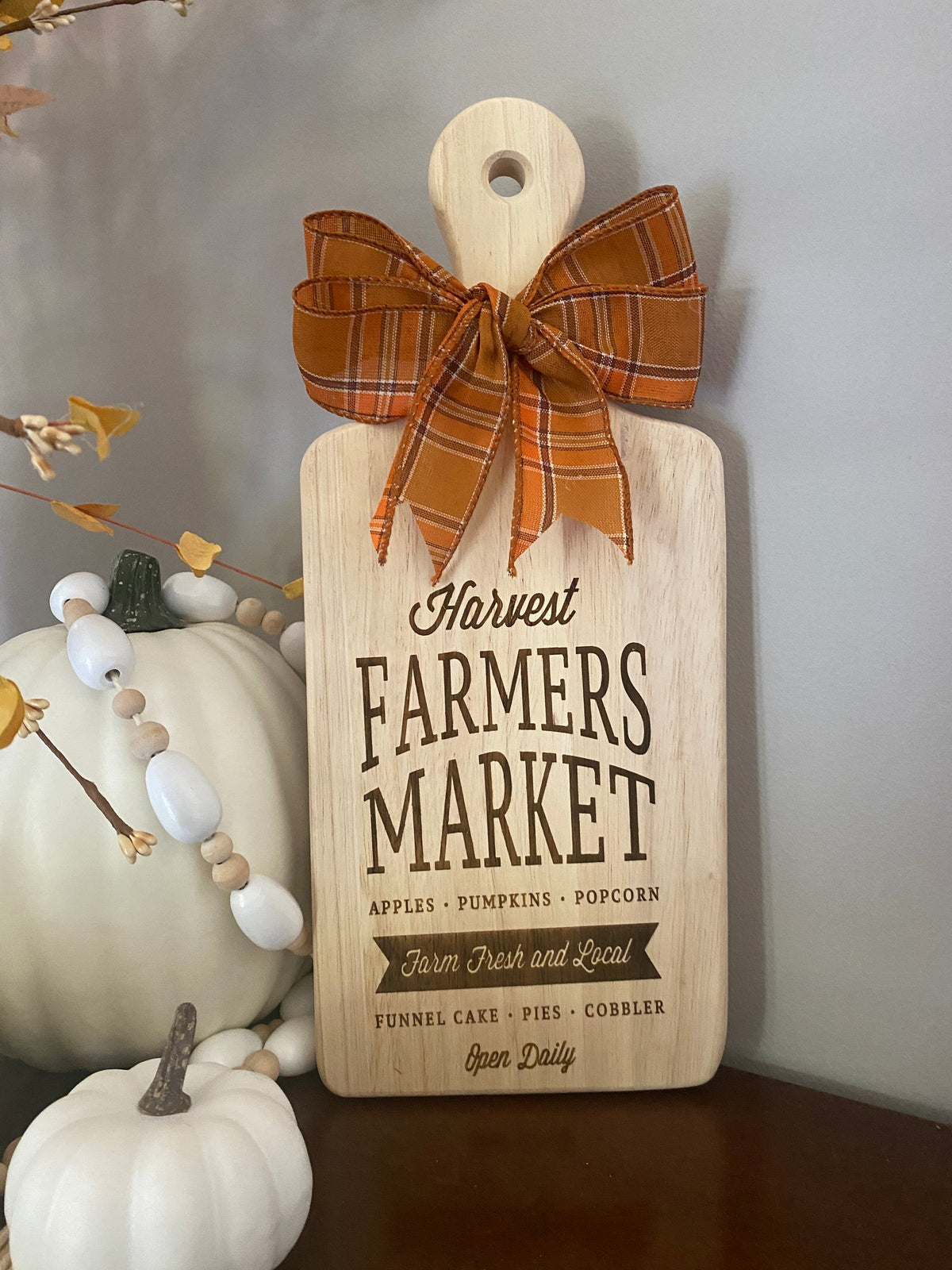 Graceful Creations by Graciela decorative wooden cutting board with fall harvest engraving and orange plaid bow