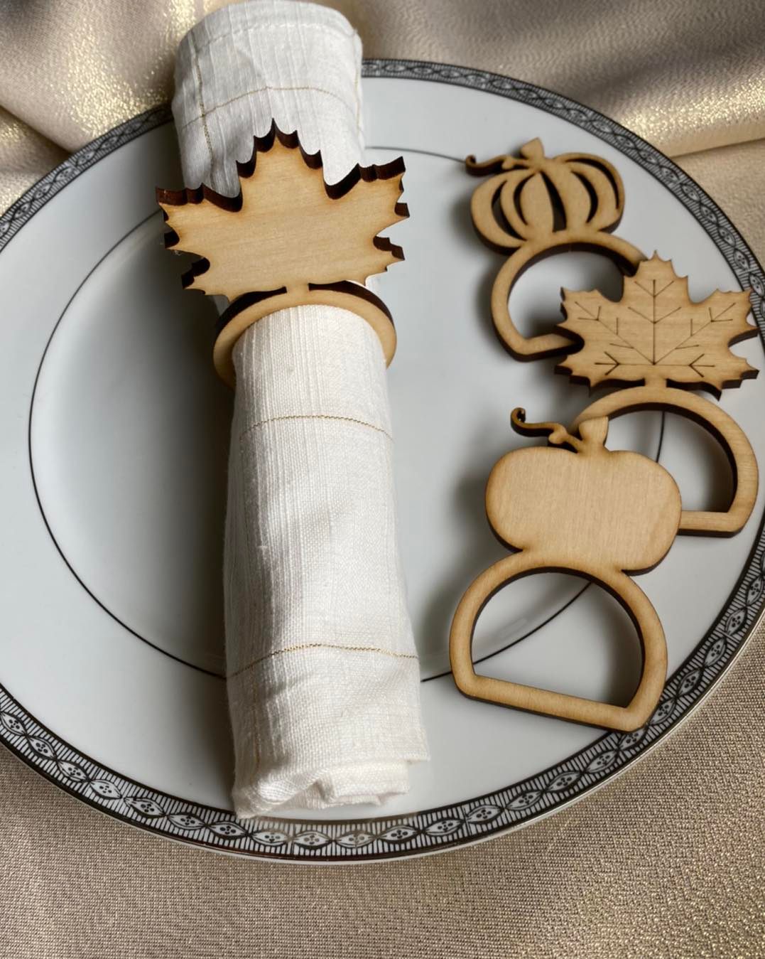 Graceful Creations by Graciela handcrafted wood Thanksgiving napkin rings in maple leaf and pumpkin shapes.