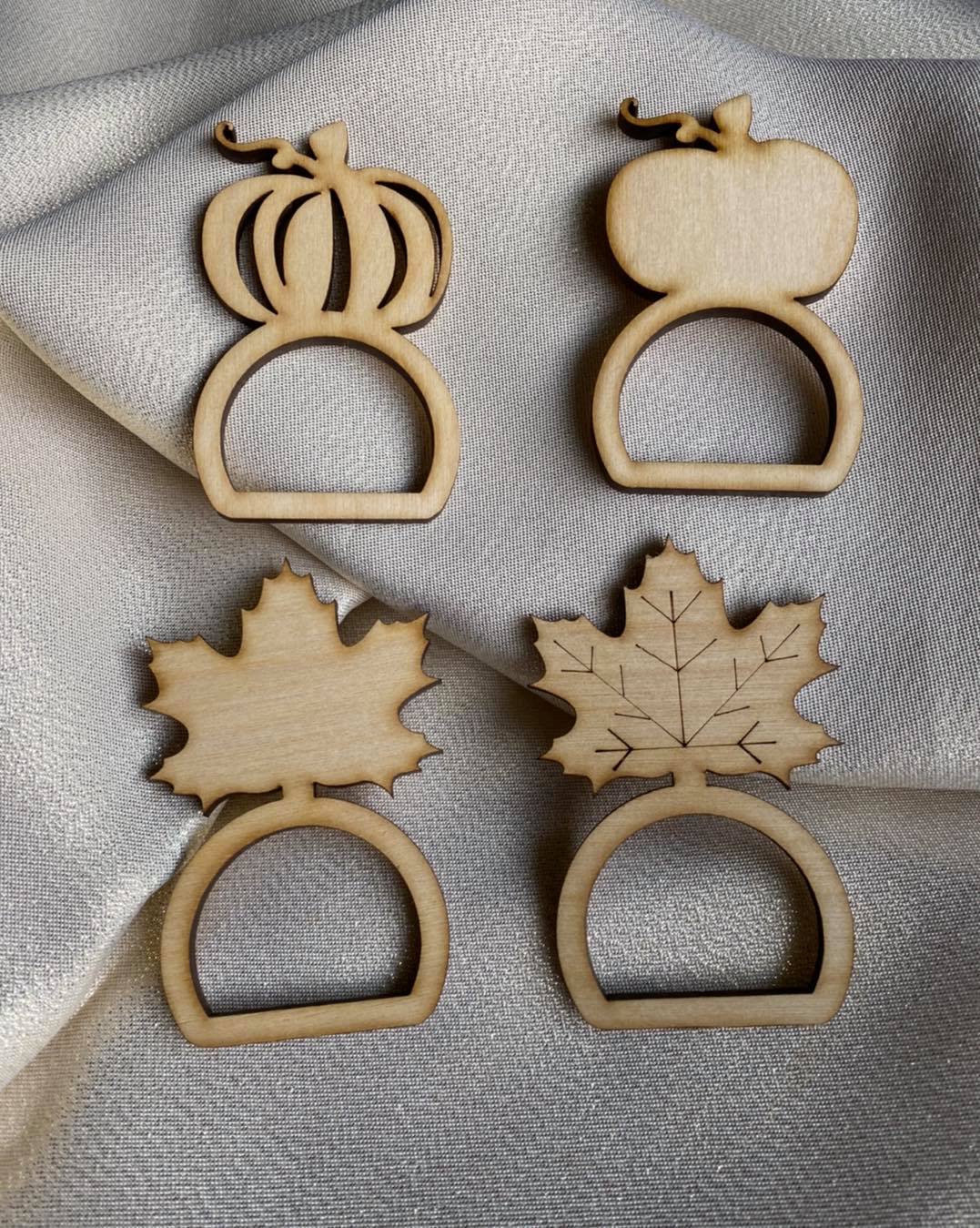 Graceful Creations by Graciela handcrafted wood Thanksgiving napkin rings in pumpkin and maple leaf shapes.